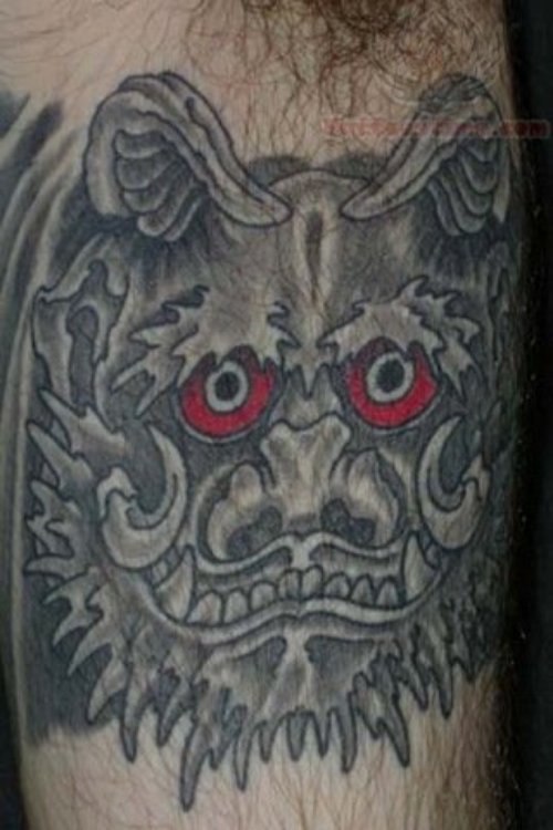 Red Ink Foo Dog Tattoo On Muscle
